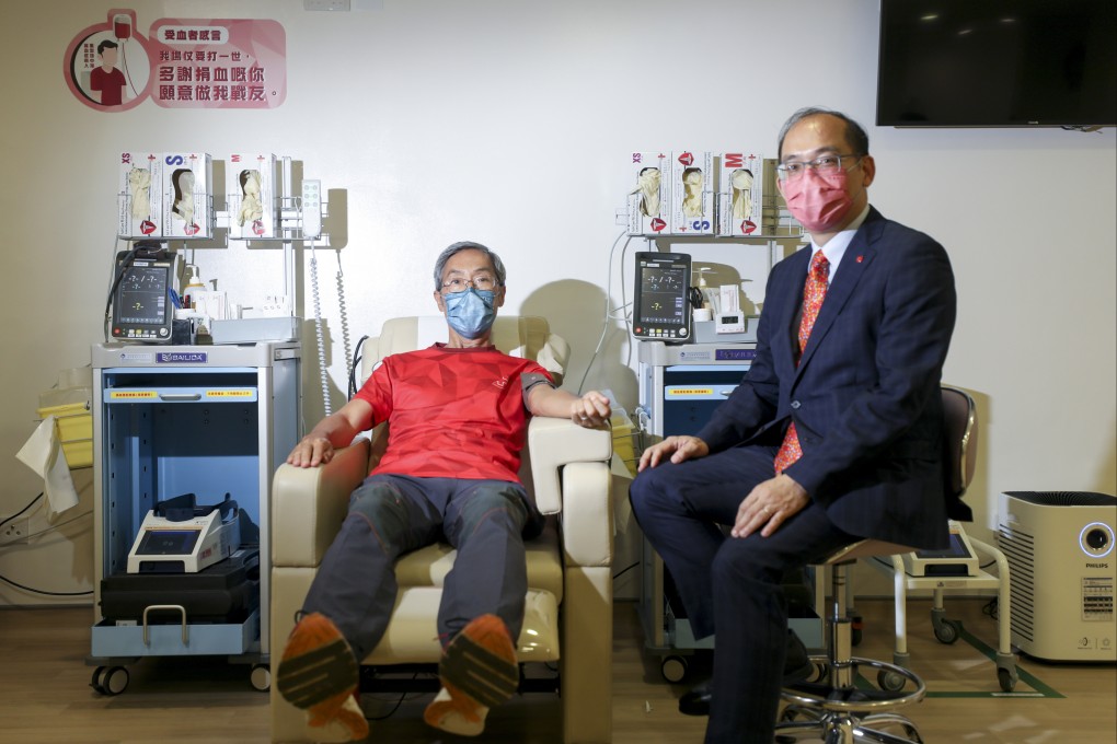 Blood donation day: giving blood is easy and doesn’t hurt, says retired Hong Kong engineer Kwan Sek-yiu (left, with Hong Kong Red Cross’ chief executive Dr Lee Cheuk-Kwong). Photo: Xiaomei Chen