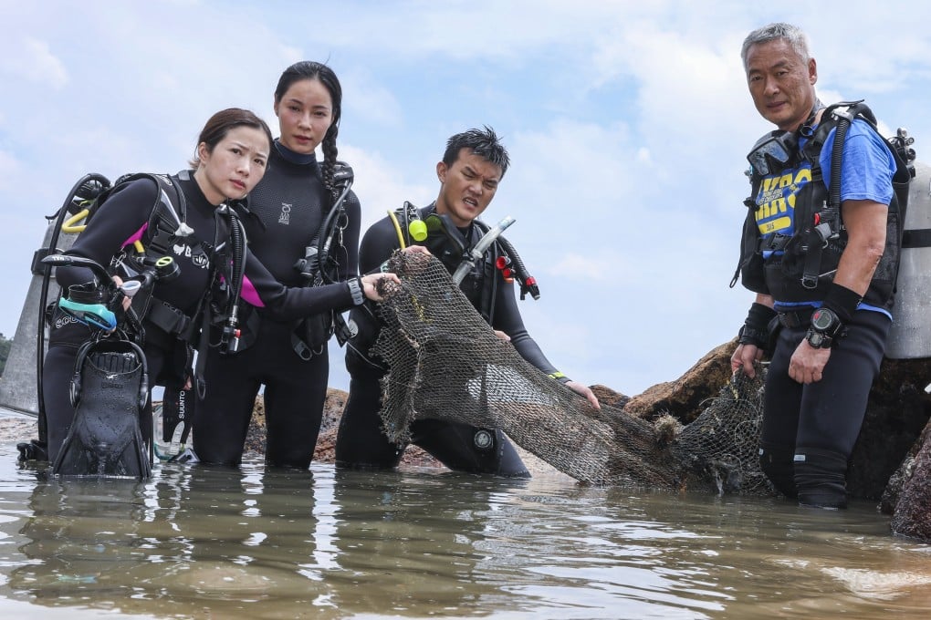 “Ghostnet Hunter” Harry Chan (right) with divers (from left), Bono Ng, Hidy Yu and Darrey Lo clear ghost nets - abandoned fishing nets that can trap marine life - in Stanley, Hong Kong. Photo: K. Y. Cheng