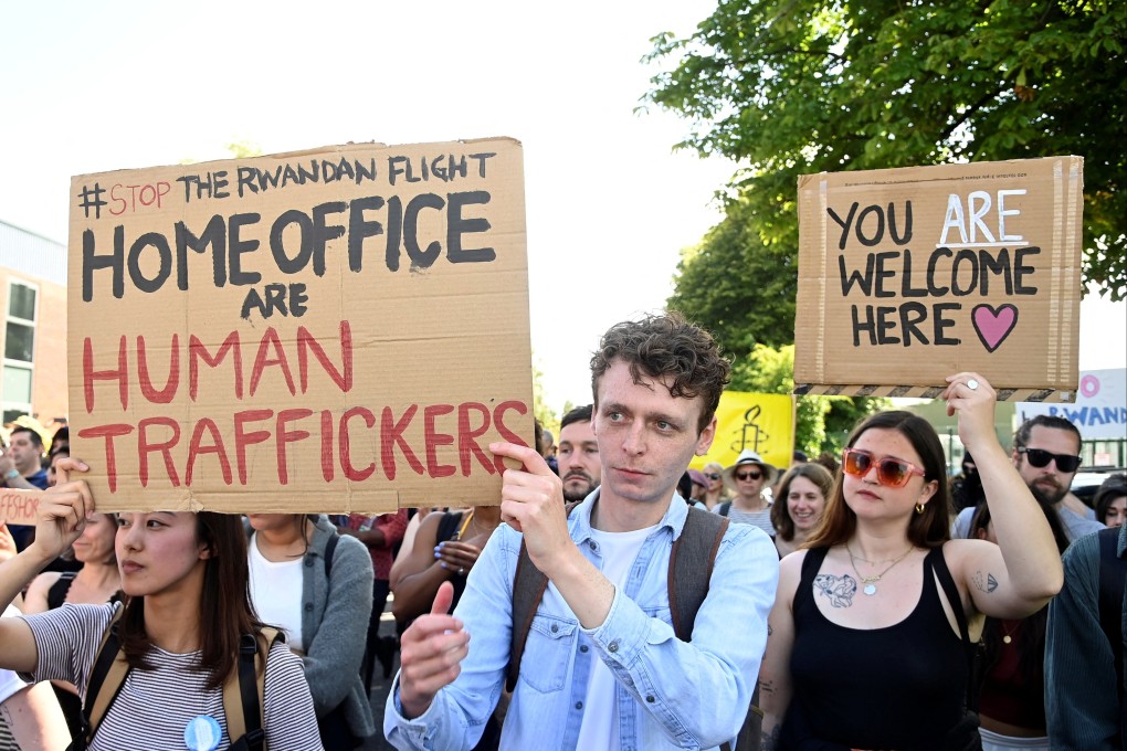 Demonstrators protest outside the UK’s Gatwick Airport on Sunday against a planned deportation of asylum seekers from Britain to Rwanda. Photo: Reuters