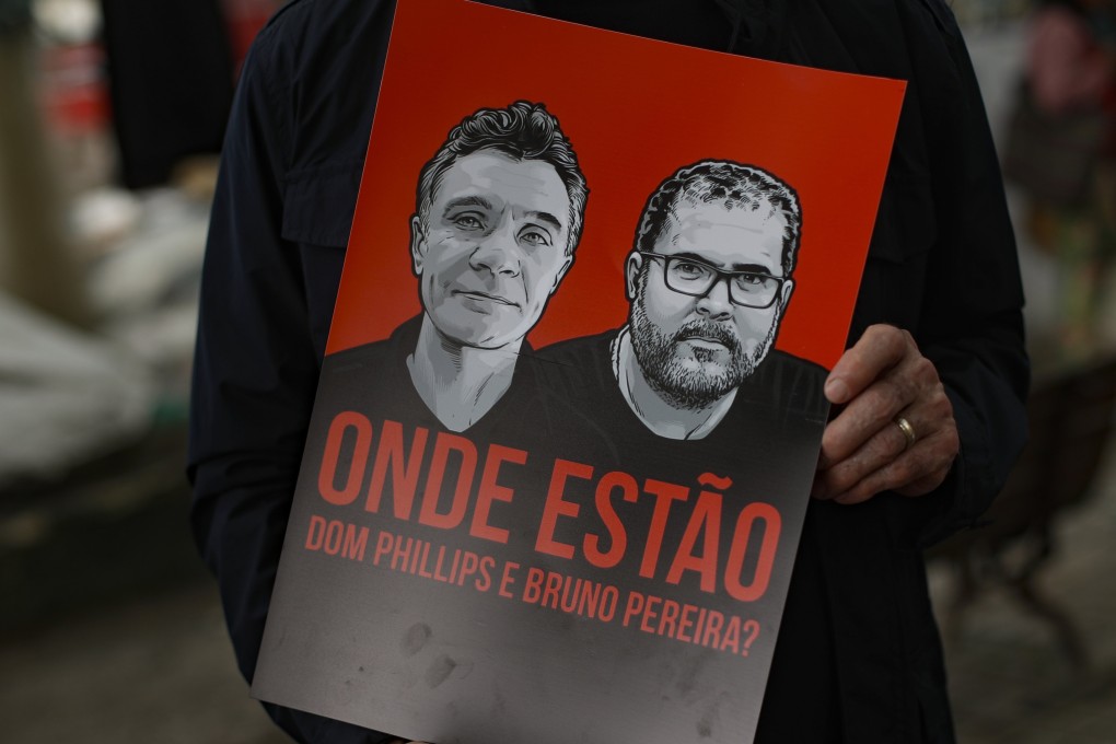 A poster showing images of British journalist Dom Phillips, left, and expert on indigenous affairs Bruno Araujo Pereira. Photo: AP