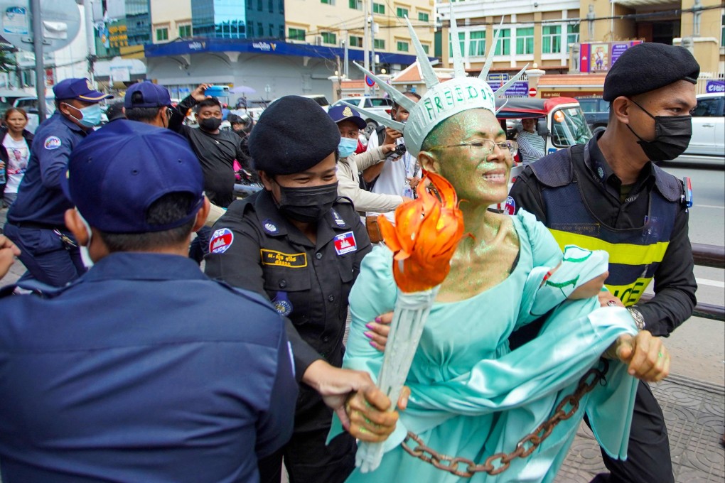 Cambodian-American lawyer and human rights advocate Theary Seng, dressed as Lady Liberty, is arrested by police in Phnom Penh on Tuesday after being found guilty of treason. Photo: AFP
