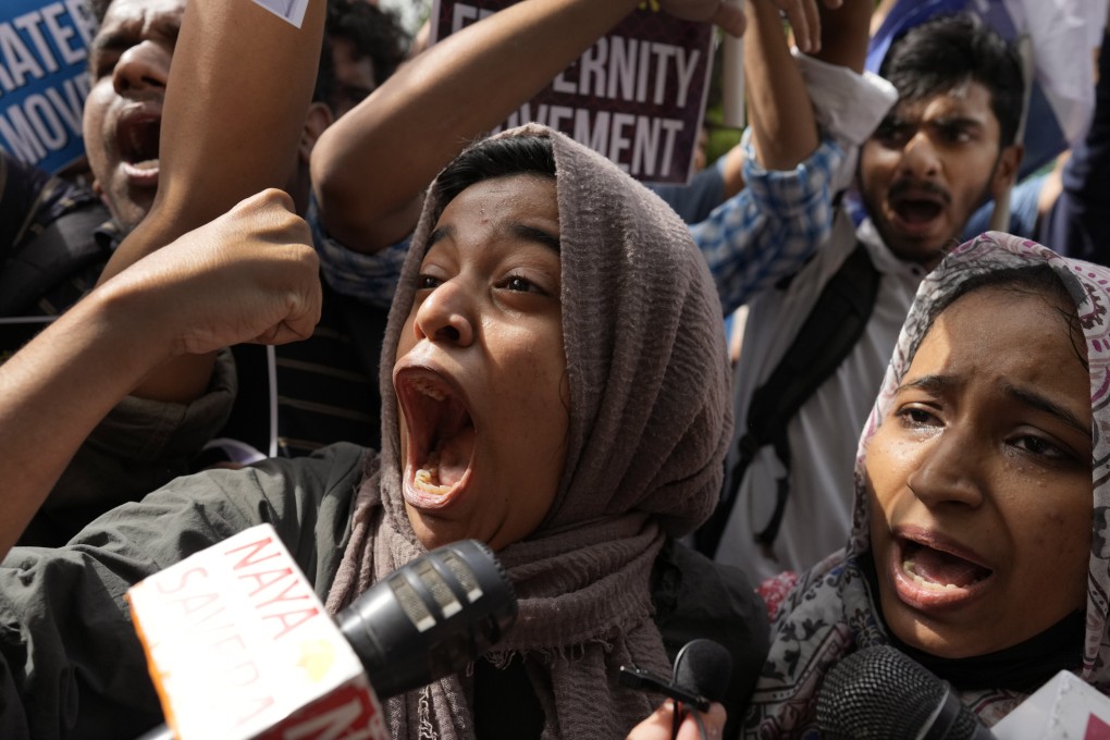 Muslim students shout anti-government slogans during a protest in New Delhi on Monday against the persecution of Muslims in India. Photo: AP