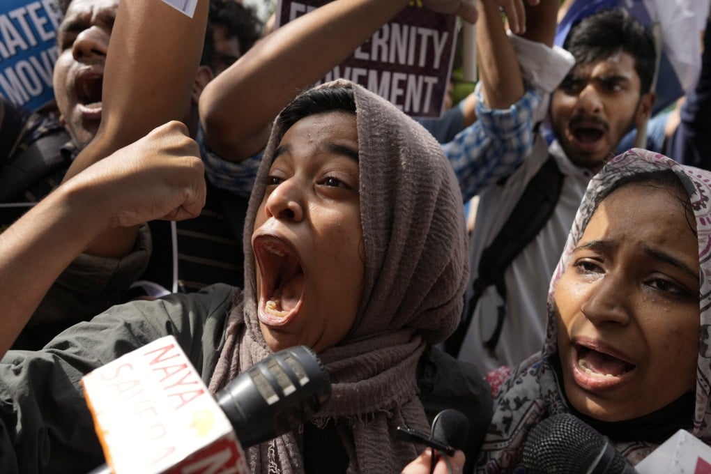 Muslim students shout anti-government slogans during a protest in New Delhi on Monday against the persecution of Muslims in India. Photo: AP