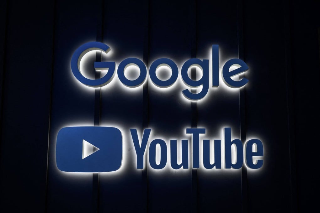 A photo shows the logo signs of Google and YouTube at their stand ahead of the World Economic Forum annual meeting in Davos on May 22, 2022. Photo: AFP