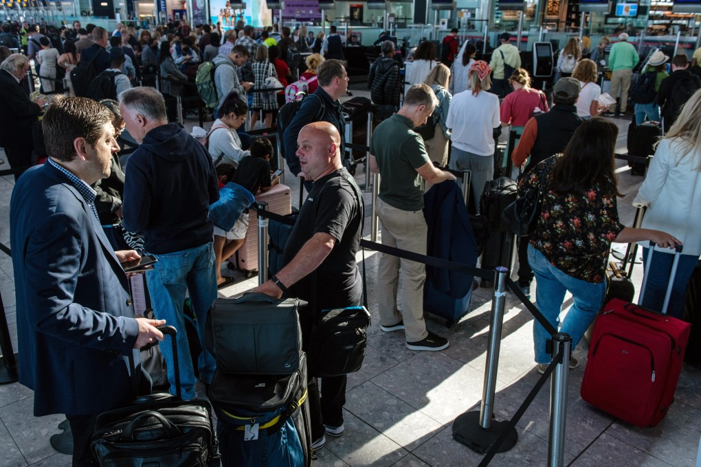 Passengers queue to check in at the departures hall of Terminal 5 at London Heathrow Airport in London, UK, on Monday, June 13, 2022. Long queues have become a feature at airports this year. Photo: Bloomberg