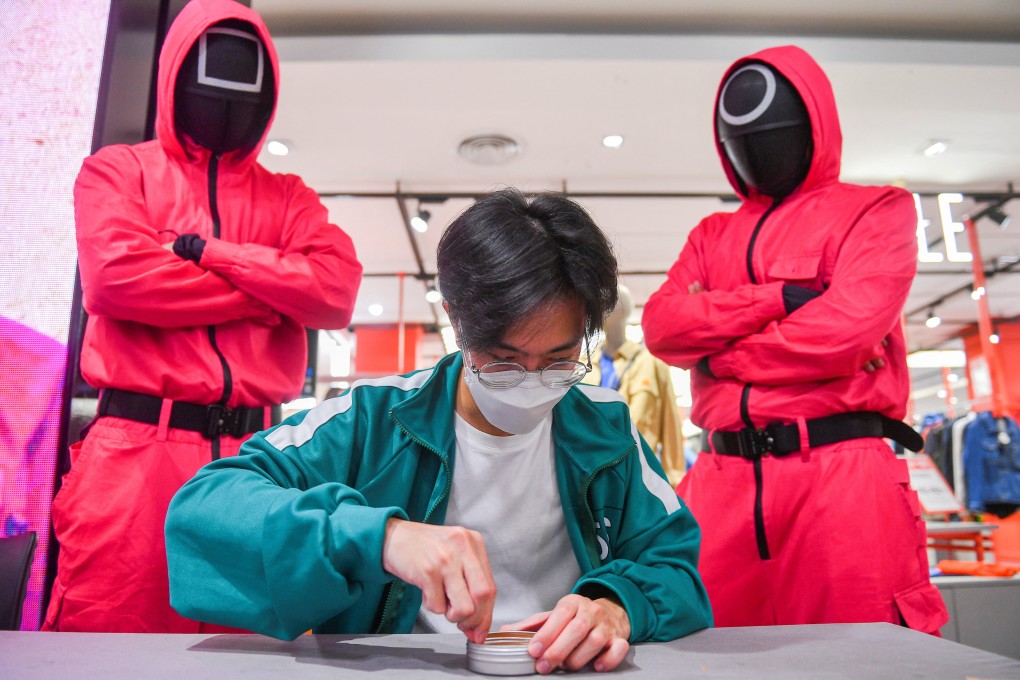 A man takes part in a “Squid Game” mission at a department store in Bangkok, Thailand in November 2021. Photo: Reuters