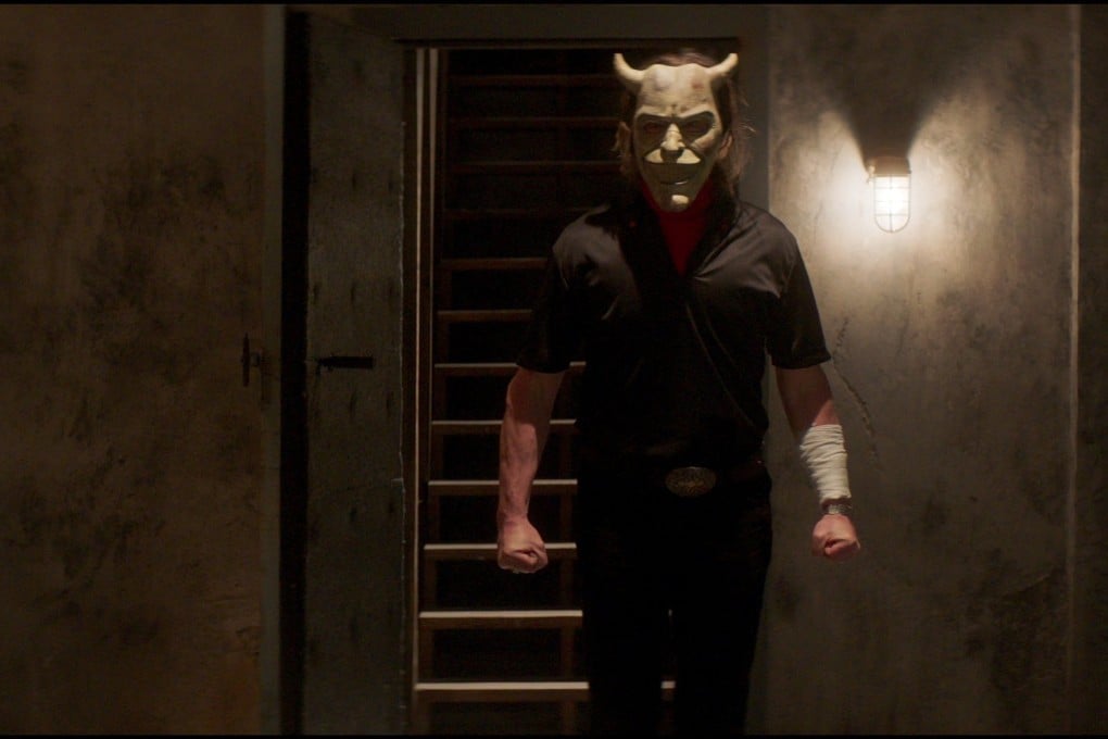 Ethan Hawke in a still from The Black Phone (category TBC), directed by Scott Derrickson. Mason Thames co-stars