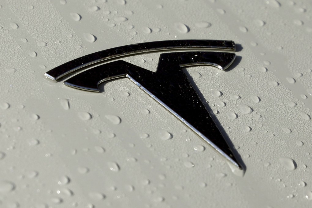 A Tesla logo seen in Salt Lake City on October 18, 2019. The government plans soon to release data on collisions involving vehicles with autonomous or partially automated driving systems that will likely single out Teslas for a disproportionately high number of such crashes. Photo: AP