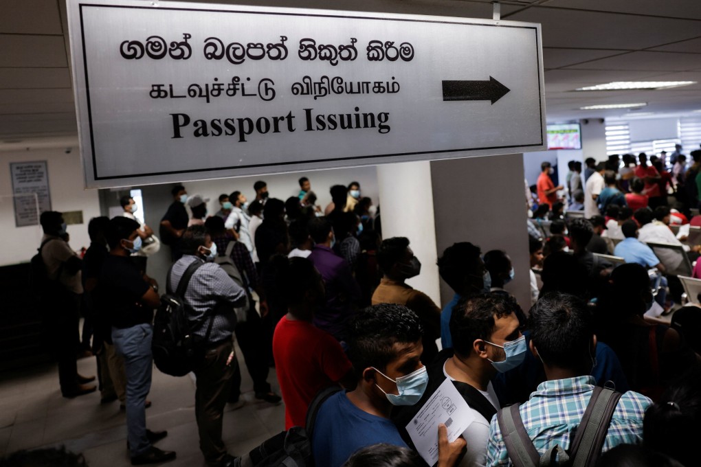 People wait to collect their passports at the Sri Lanka’s Immigration and Emigration Department, amid the country’s economic crisis, in Colombo, Sri Lanka. Photo: Reuters