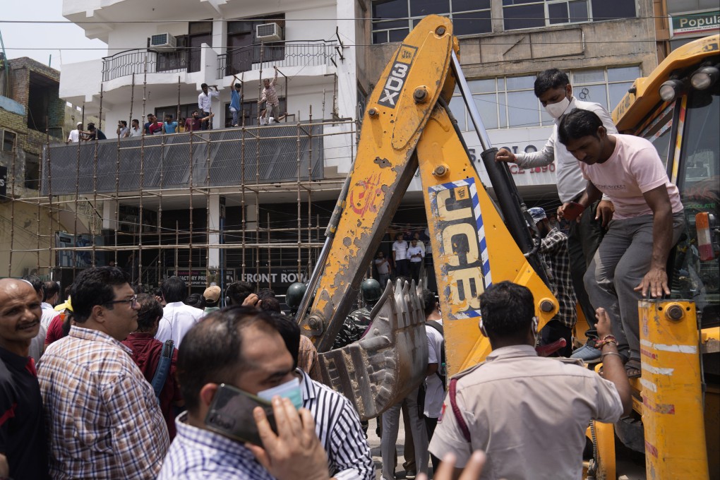 Protests have been erupting in many Indian cities to condemn the demolition of homes and businesses belonging to Muslims, in what critics call a growing pattern of “bulldozer justice” aimed at punishing activists from the minority group. Photo: AP
