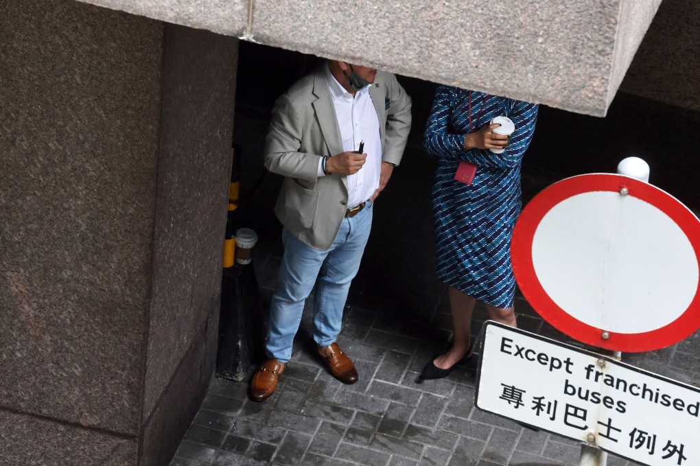 People smoke outdoors in Hong Kong’s Central district on May 26. Photo: K. Y. Cheng