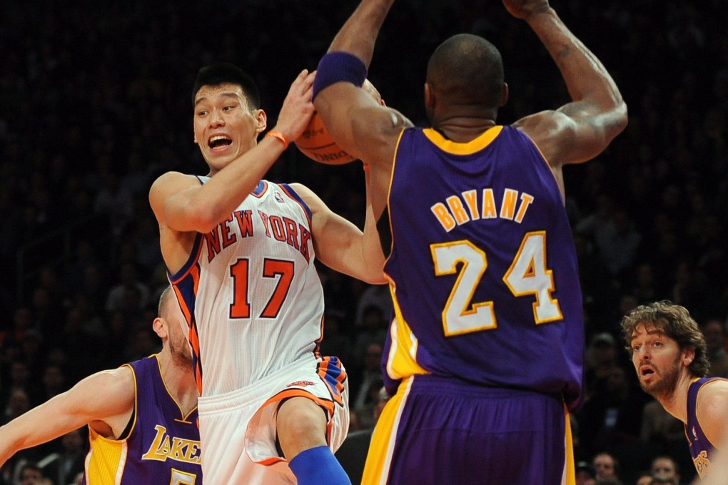 Former New York Knicks point guard Jeremy Lin drives to the basket as Los Angeles Lakers shooting guard Kobe Bryant defends at Madison Square Garden on February 10, 2012. Photo: EPA
