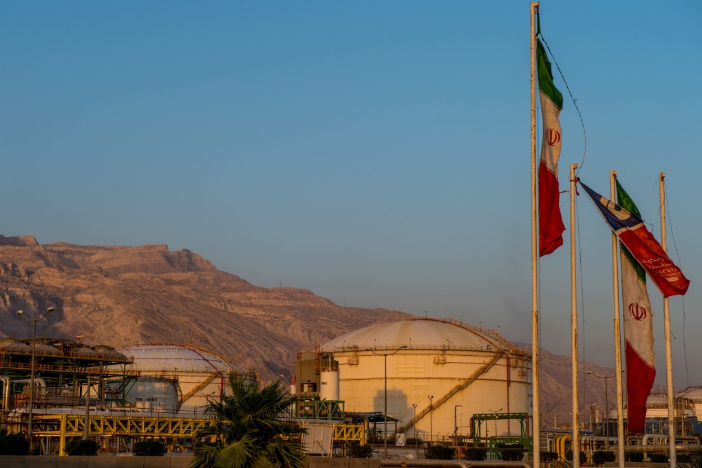 Iranian flags fly near chemical storage tanks at the Arya Sasol Polymer Co. petrochemical complex in Asaluyeh, Iran in July 2019. Photo: Bloomberg