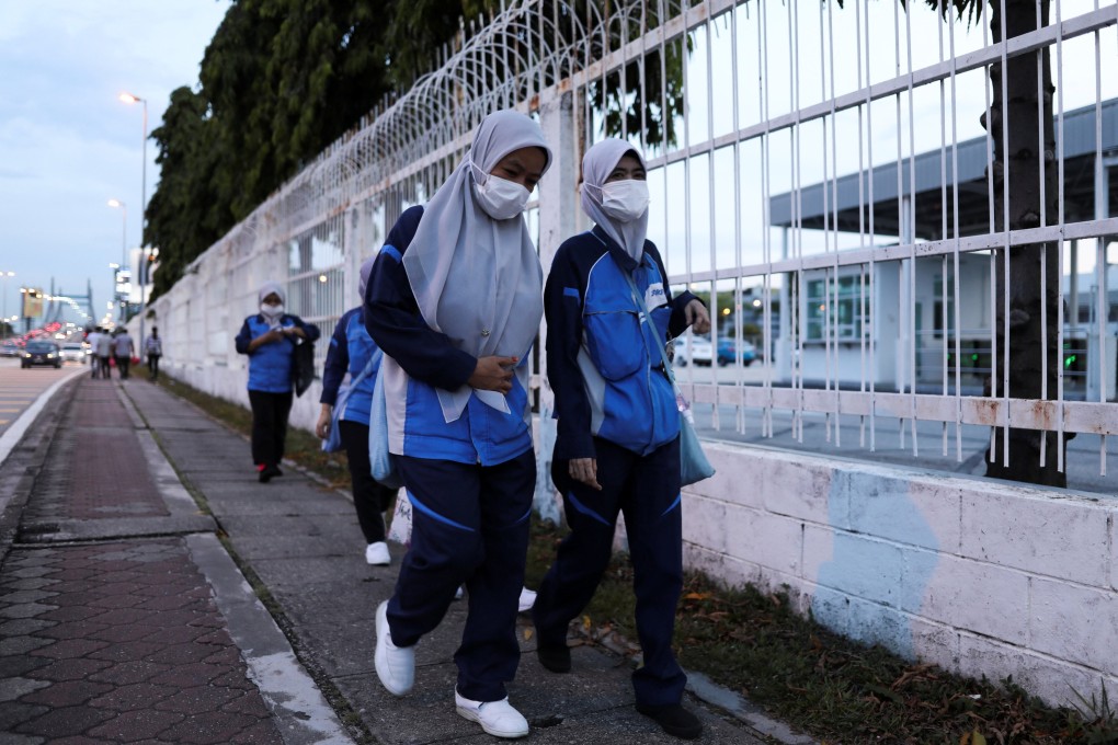 Workers return home from an electrical and electronics industrial zone at Sungei Way Free Trade Zone, in Petaling Jaya, Selangor, on June 10. Labour productivity growth has averaged 1.1 per cent in Malaysia in the past five years. Photo: Reuters