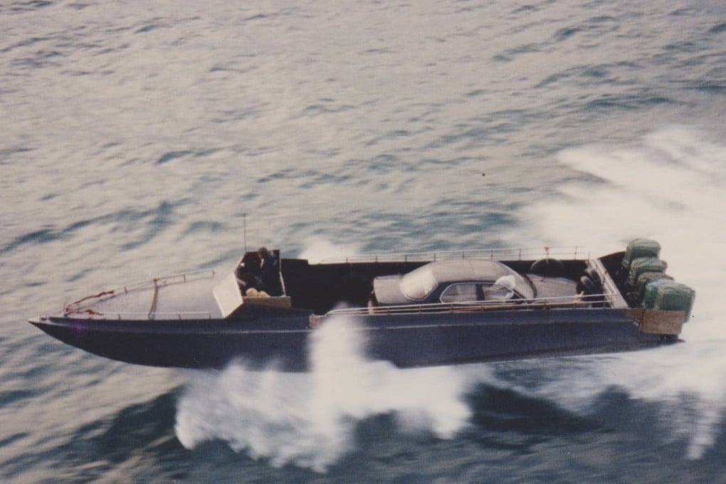 A “dai fei”, a type of powerful speedboat, races through Hong Kong waters at full speed smuggling a luxury car bound for mainland China in 1993. Photo: Courtesy of Alan Crowther