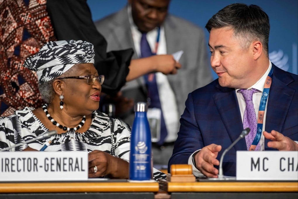 WTO director general Ngozi Okonjo-Iweala and chairman of the 12th ministerial conference Timur Suleimenov chat during the opening ceremony at the WTO headquarters in Geneva on June 12. Photo: AFP