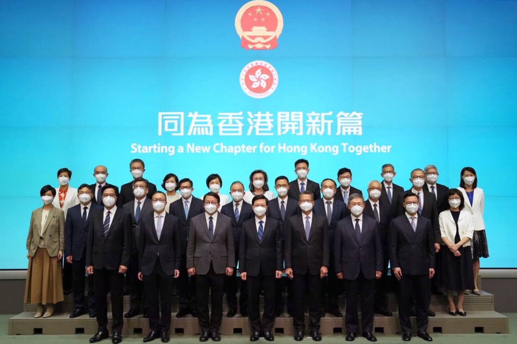 Chief Executive-designate John Lee (centre) poses for a group photo with his newly appointed cabinet. Photo: Sam Tsang