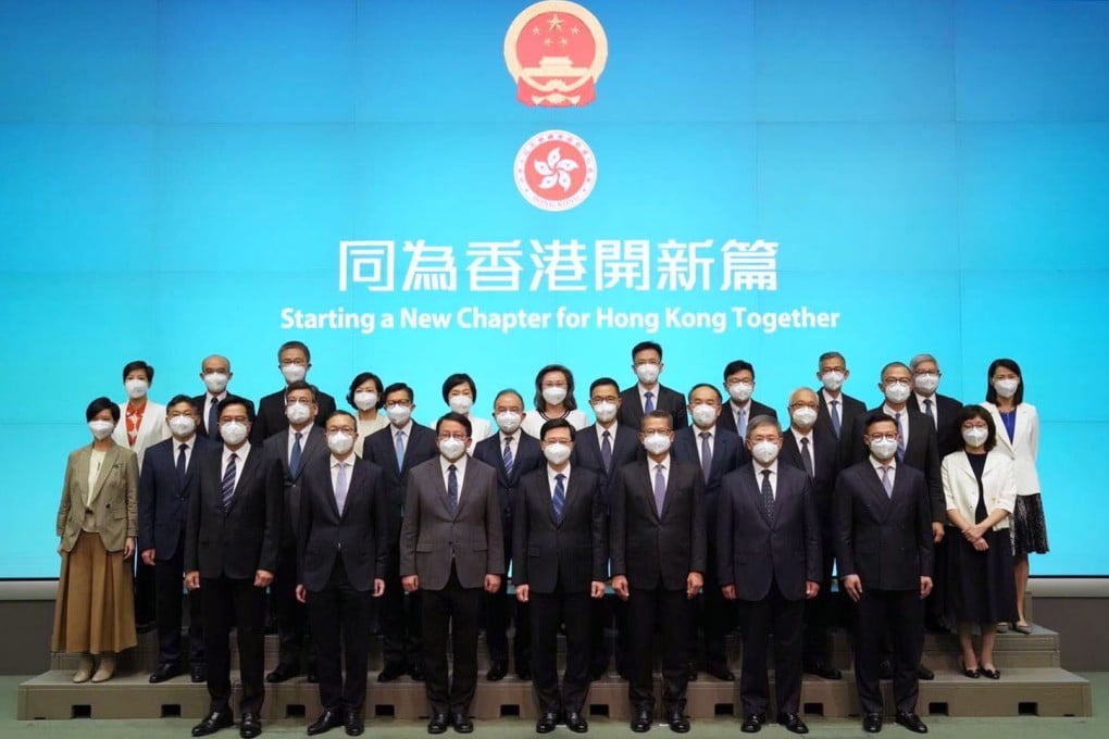 Chief Executive-designate John Lee (centre) poses for a group photo with his newly appointed cabinet. Photo: Sam Tsang
