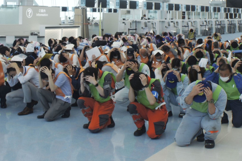 A disaster drill is conducted at Tokyo’s Haneda airport last month, as a massive earthquake may hit Tokyo in the future. Japan’s west coast was jolted by a 5.2 magnitude quake on Sunday. File photo: Kyodo