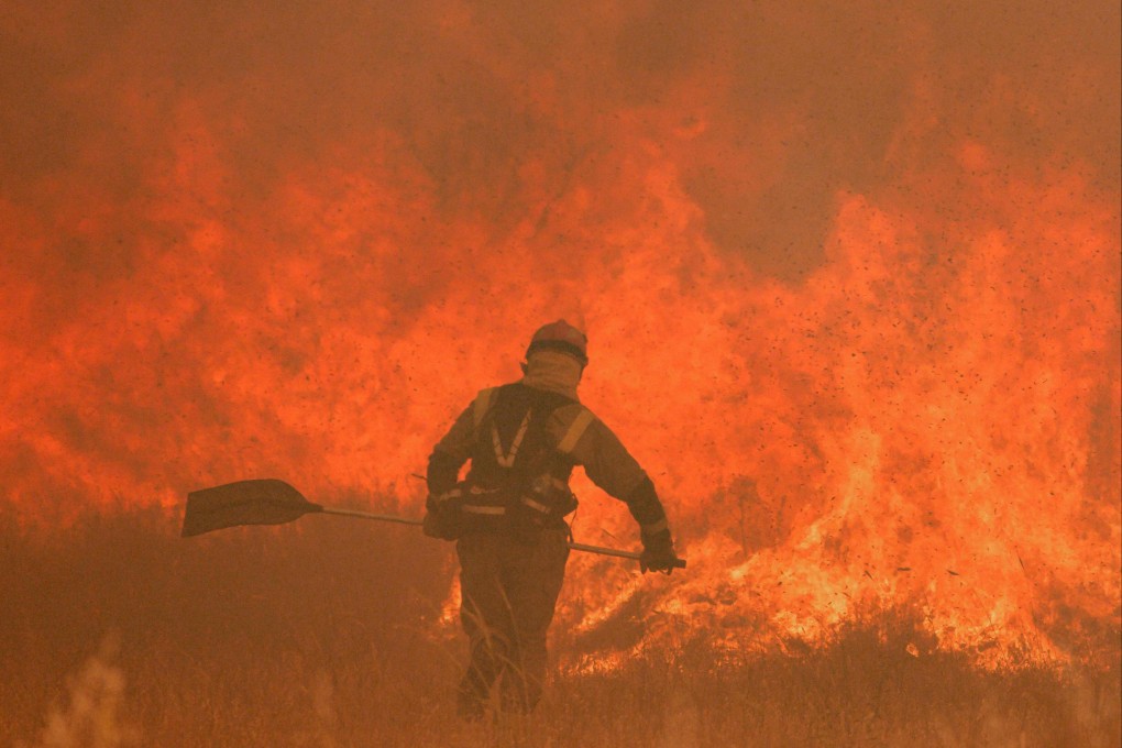 A firefighter operates at the site of a fire in Pumarejo de Tera near Zamora, northern Spain, on Saturday. Photo: AFP