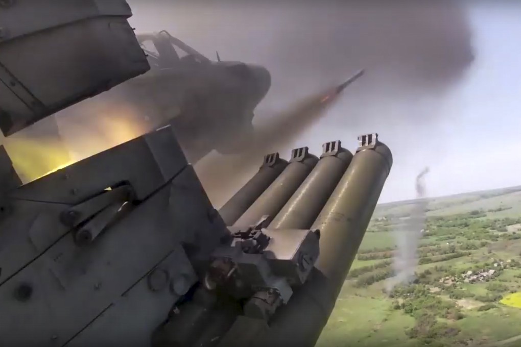 A Russian helicopter gunship fires rockets at an undisclosed location in Ukraine. Photo: Russian Defence Ministry Press Service via AP