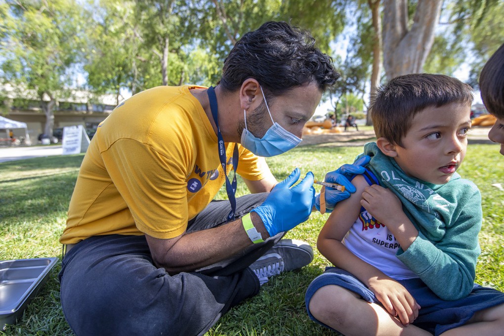 A doctor administers a Covid-19 vaccine to a 5-year-old boy in Los Angeles. Photo: Los Angeles Times / TNS