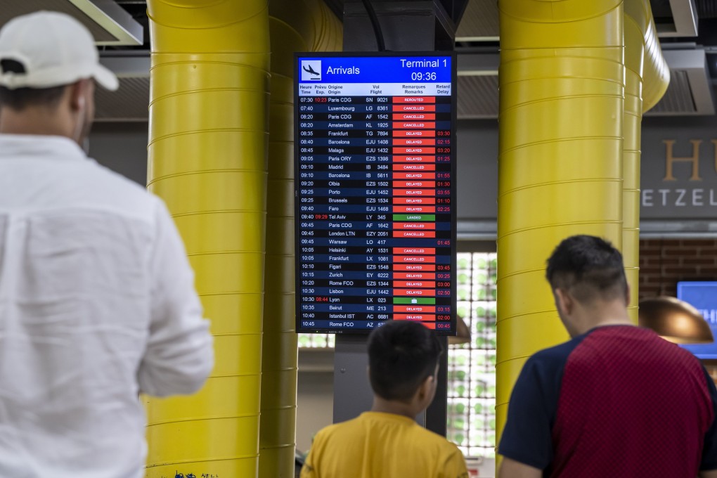 People check the arrivals board at an airport. The aviation industry’s severe staff shortage has led to delays, cancellations and extreme frustration for airlines and travellers. Photo: EPA-EFE