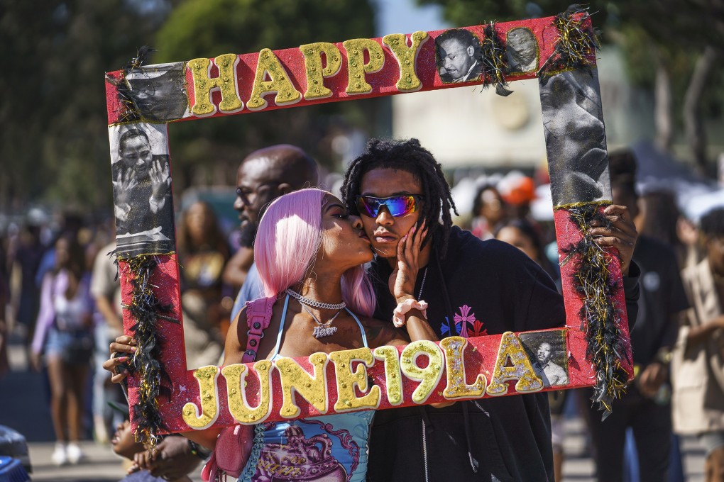 Daisa Chantel kisses Anthony Beltran as they celebrate “Juneteenth” 2022 in Los Angeles, US. Photo: AP