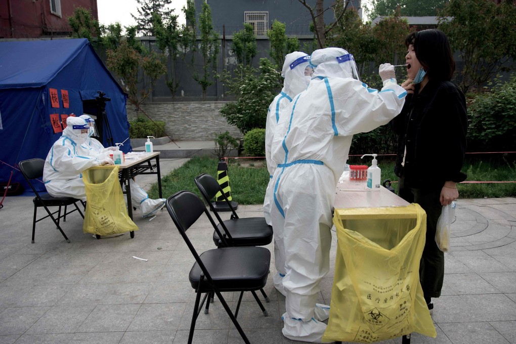 A person has a Covid-19 test taken in Beijing in April. China is drifting apart from the rest of the world due to its hardline pandemic restrictions, European ambassadors say. Photo: AFP
