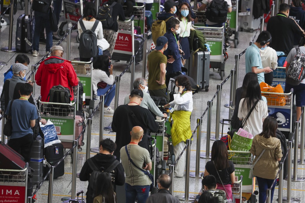 People wait to be quarantined at the arrival hall of Hong Kong airport on May 26. Photo: Yik Yeung-man