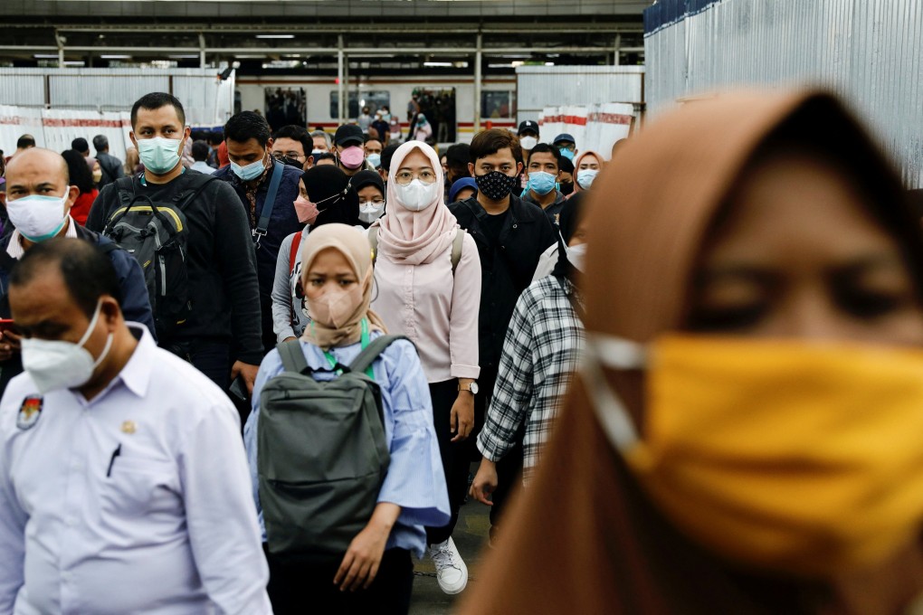 People at a train station during the afternoon rush hour in Jakarta. Photo: Reuters