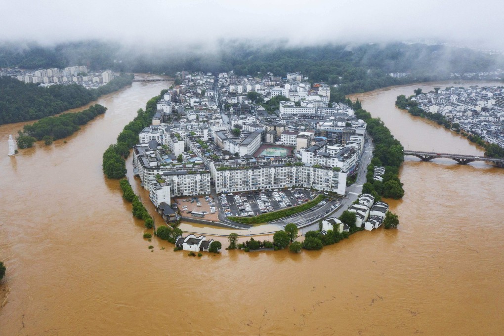 Heavy rain floods streets and buildings in Wuyuan, in China’s central Jiangxi province on Monday. Photo: CNS/AFP