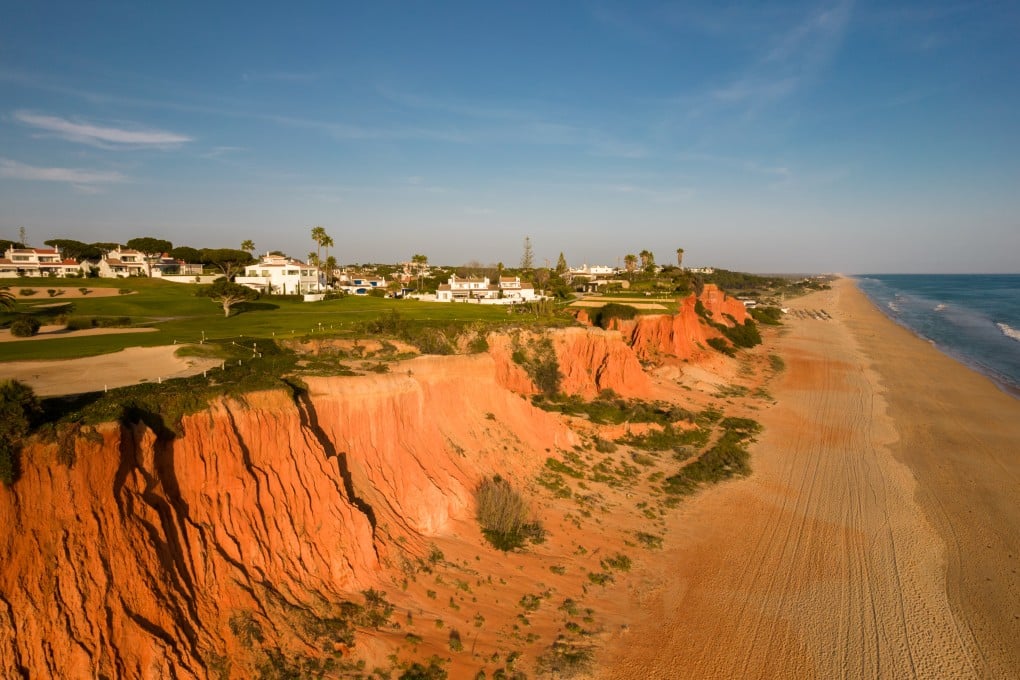 Golf courses next to a wide, empty beach look out over the water in Vale do Lobo, Algarve, Portugal. Such scenes have long made Portugal an attractive country for retirement. Photo: Getty Images