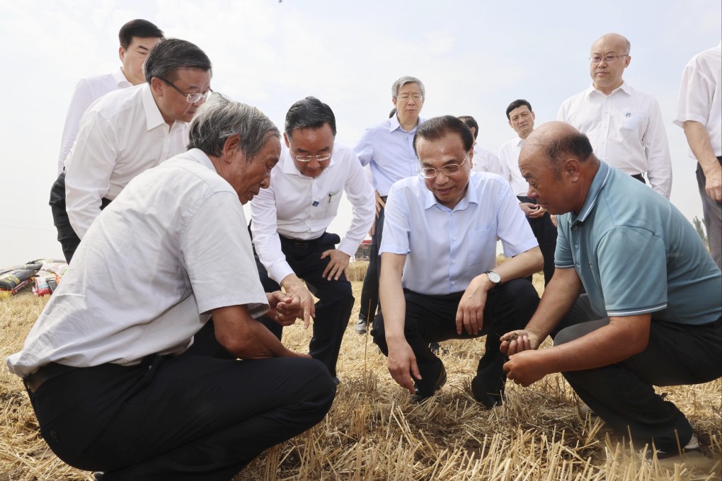 Premier Li Keqiang told farmers and traders that the government would work to stabilise grain and energy prices this year. Photo: Xinhua