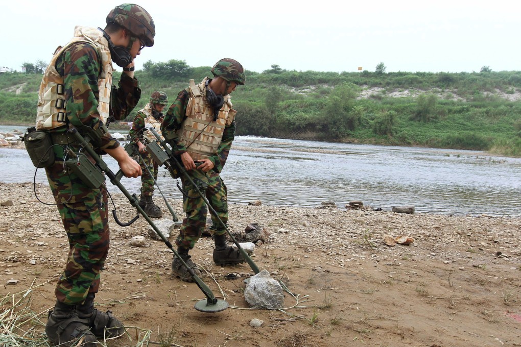 South Korean soldiers search for landmines in Yeoncheon, north of Seoul, near the demilitarised zone that separates the two Koreas in 2010. Photo: Yonhap via AP