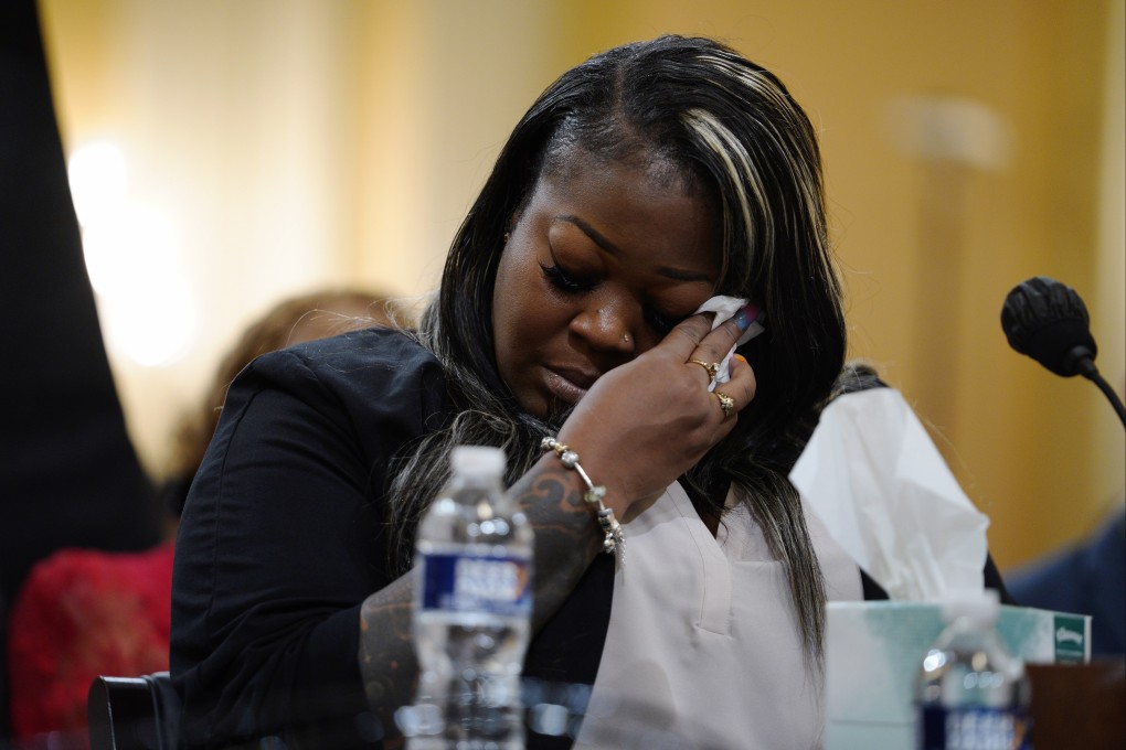 Former Georgia election worker Shaye Moss wipes tears with a tissue as she watches a video of her mother Ruby Freeman’s testimony during a public Capitol riot hearing on Tuesday. Photo: EPA-EFE
