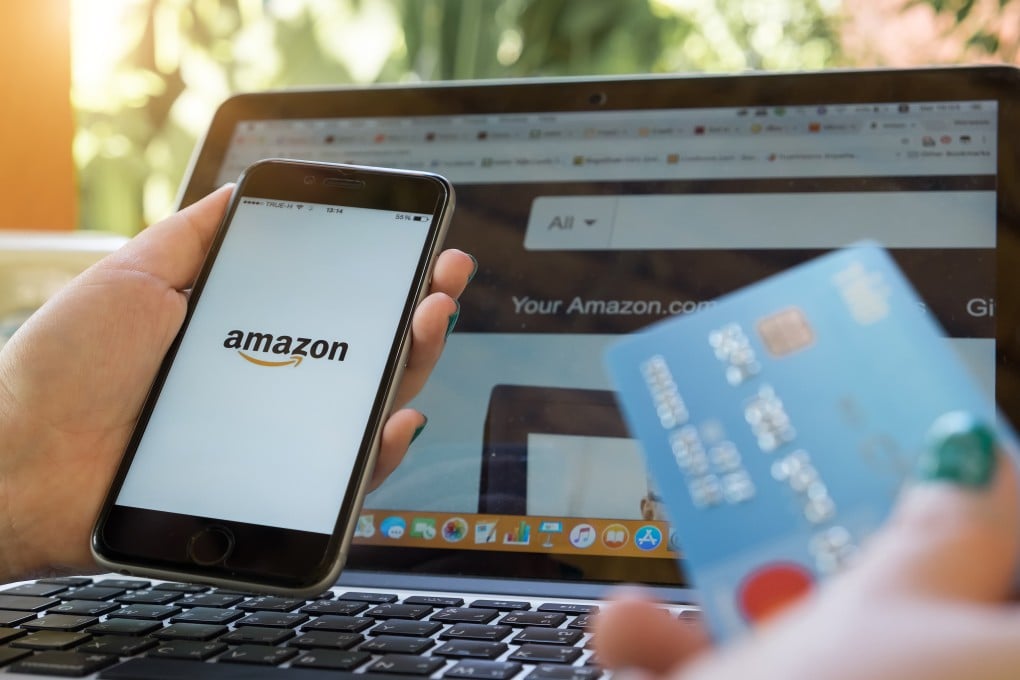 An iPhone 6s showing Amazon logo and credit card for shopping online. Photo: Shutterstock Images