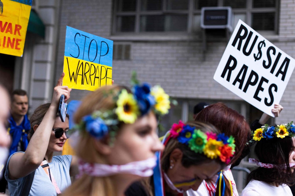 Activists protest rape during war and gather to support Ukraine in front of the Russian Consulate in New York in May. Photo: AFP