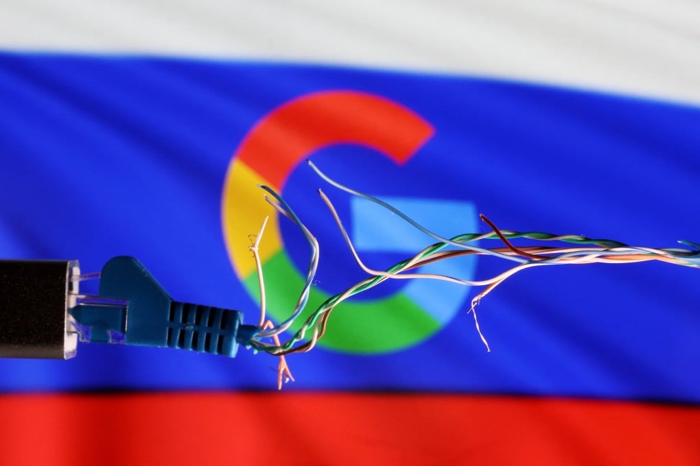 A broken Ethernet cable is seen in front of the Russian flag and Google logo in this illustration taken March 11, 2022. Photo:
Reuters