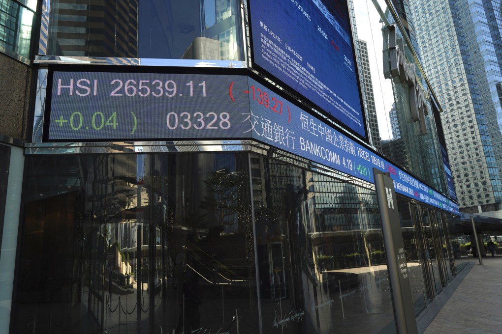 A electronic board showing the Hang Seng Index and stock tickers outside the Exchange Square in Central, Hong Kong. Photo: AP