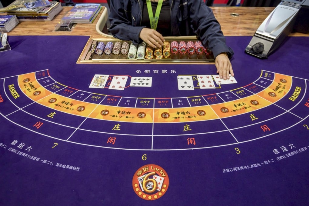 Cards are handled on a baccarat table during the Global Gaming Expo Asia (G2E Asia) in Macau, China, on Tuesday, May 21, 2019. The expo runs through May 23. Photographer: Paul Yeung/Bloomberg