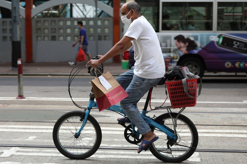A delivery worker rides through Wan Chai on July 15, 2020. Photo: Nora Tam