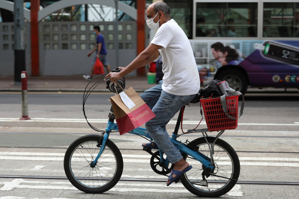 A delivery worker rides through Wan Chai on July 15, 2020. Photo: Nora Tam