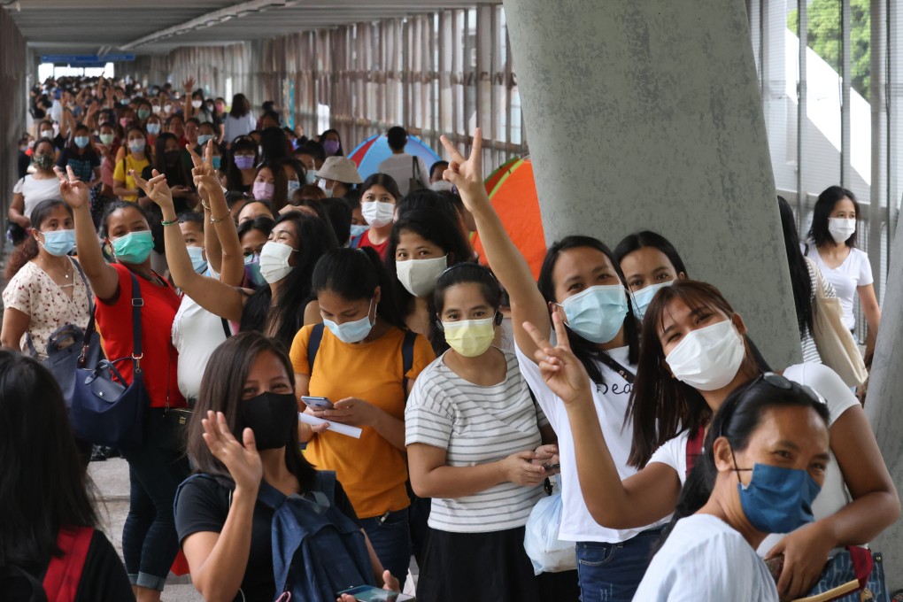 Filipinos queue up near the Philippine Consulate General in Hong Kong on October 3, 2021, a Sunday, to register for voting. Foreign domestic workers should be rewarded for their sacrifice and hard work during the pandemic. Photo: Nora Tam