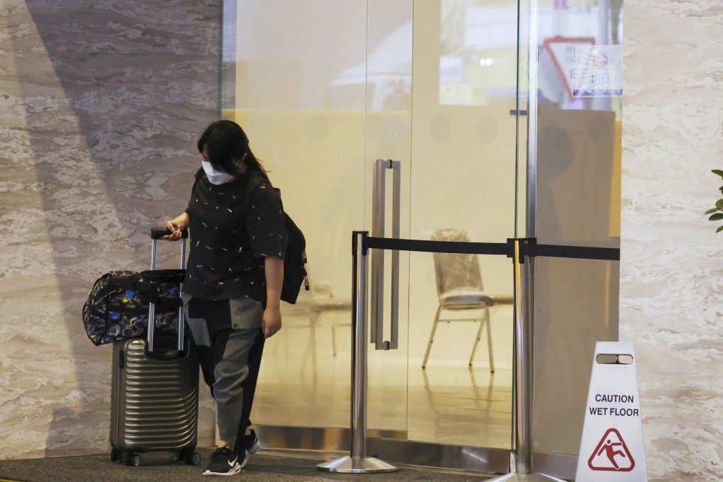 A guest leaves Novotel Century Hong Kong, a quarantine hotel in Wan Chai, on June 15. Photo: Edmond So