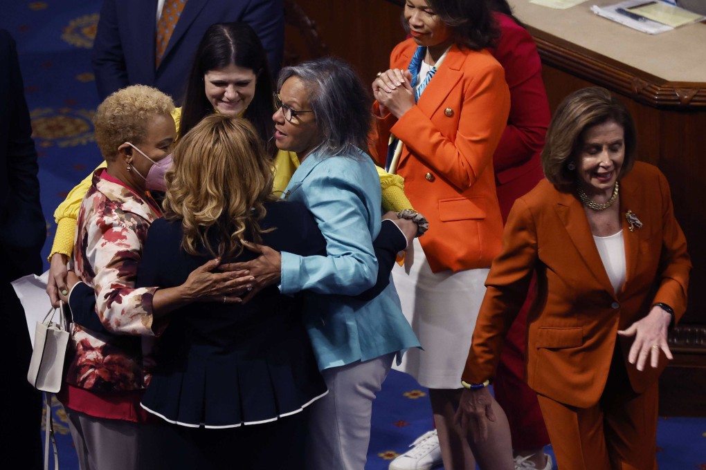 (From left) US congresswomen Barbara Lee, Haley Stevens and Robin Kelly embrace colleague Lucy McBath, whose son was killed by gun violence, after House Speaker Nancy Pelosi (right) announced the passage of the Bipartisan Safer Communities Act in the House Chamber on Friday. Photo: AFP