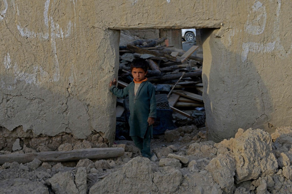 A boy stands among the rubble of a destroyed house following the earthquake in Afghanistan. Photo: AFP