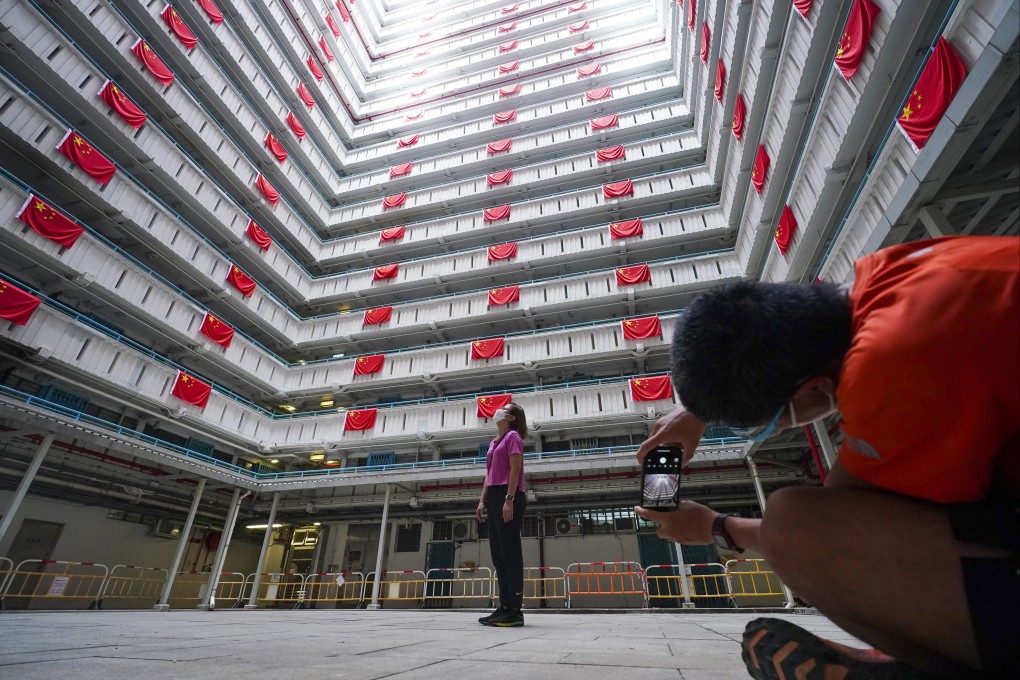 National and Hong Kong flags hang on every floor of Lam Shek House at Ping Shek Estate in Kwun Tong. Photo: Felix Wong