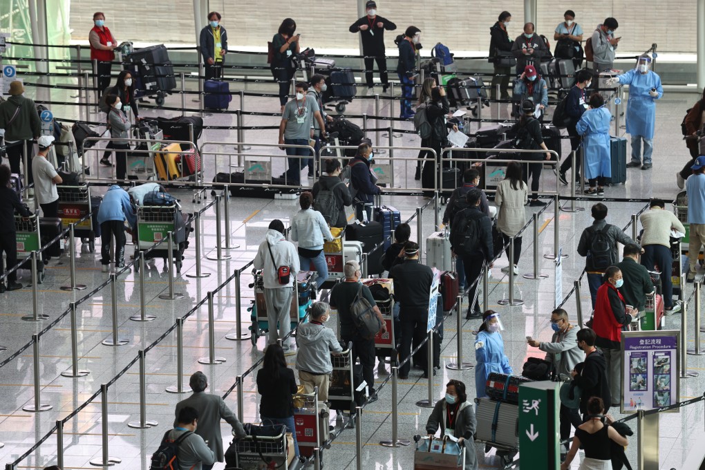 Passengers, who have just landed at Hong Kong International Airport, queue to take their PCR tests before heading to their quarantine hotels. Photo: K.Y. Cheng