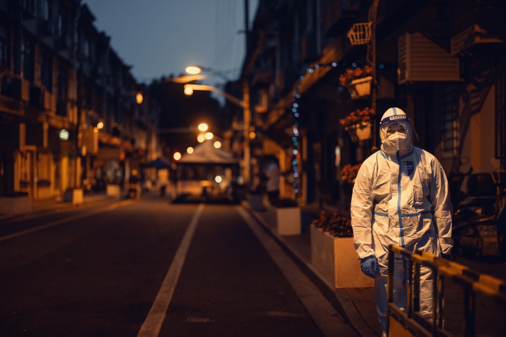 A police officer in protective gear seen on the street during the Covid-19 lockdown in Shanghai in May. Photo:  EPA-EFE